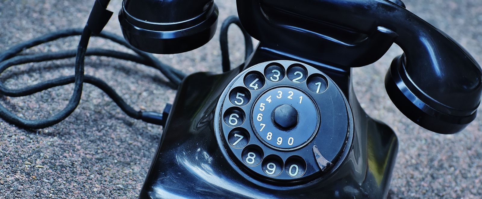 A vintage rotary telephone with the handset resting beside it — the missed call every business ignores